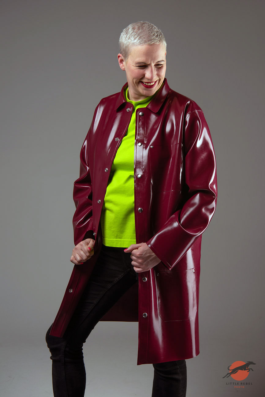 Wrapped in Rubber founder Charlie Goldthorpe wearing a glossy burgundy chore jacket