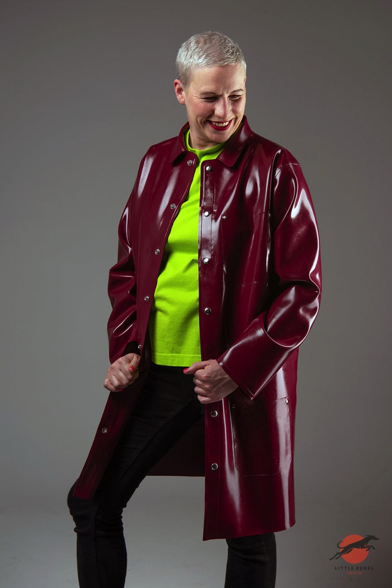 Wrapped in Rubber founder Charlie Goldthorpe wearing a glossy burgundy chore jacket